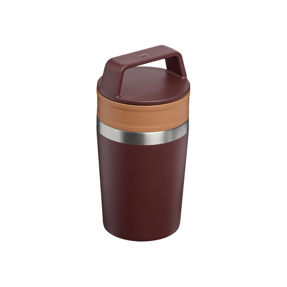 A vacuum-insulated travel tumbler with a dark reddish-brown body, a tan band, and a matching brown lid with a carry handle, shown on a plain white background.