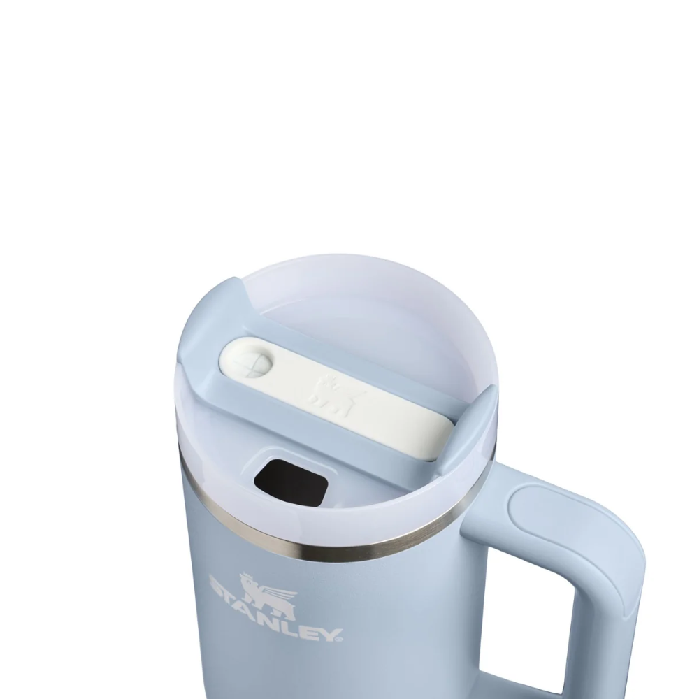 A light blue Stanley insulated mug with a matching lid and handle, shown on a plain white background.