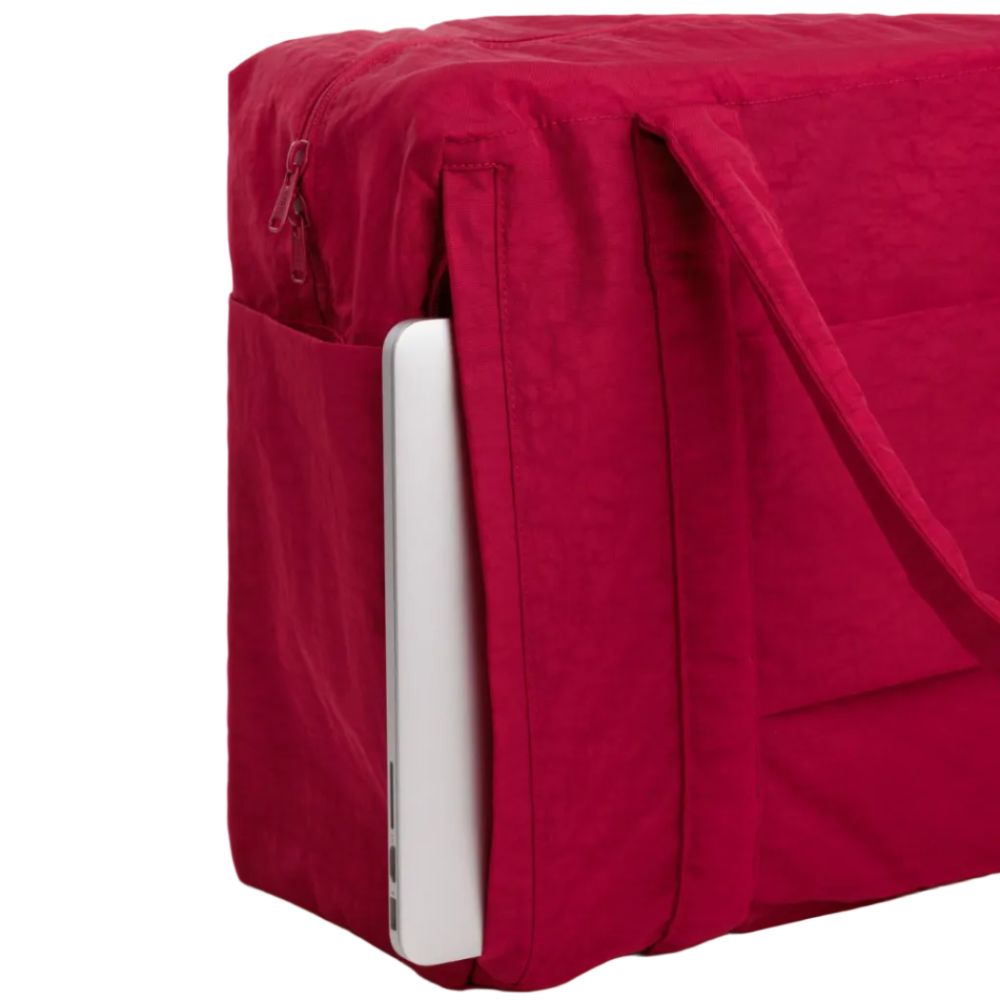 Red laptop sleeve with a white laptop inside on a light gray background