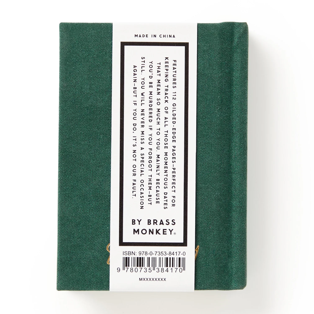 Green notebook with a label on a white background