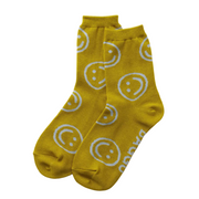 Yellow socks with smiley face patterns on a light gray background