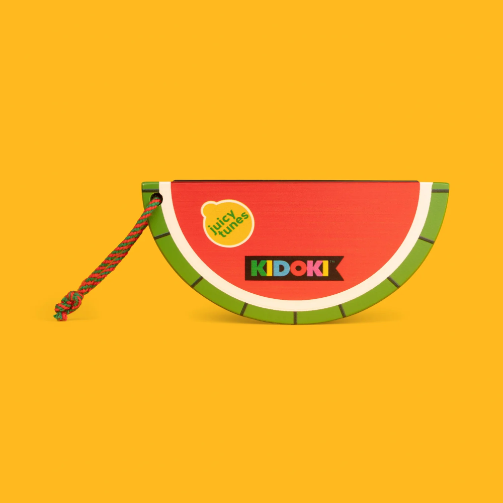 Watermelon-shaped harmonica with 'KIDOKI' branding on a yellow background