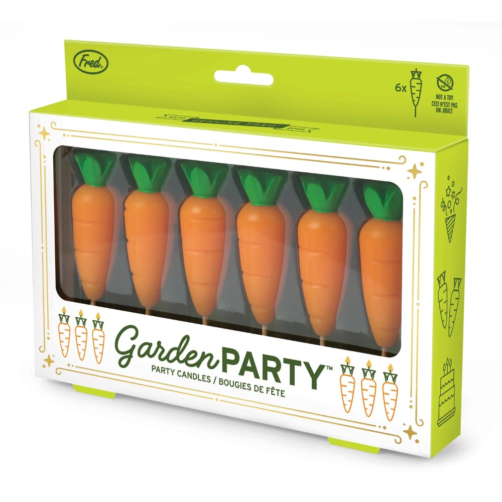 Packaging of 'Garden Party' carrot-shaped candles with green tops.