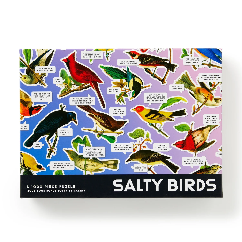A 1000-piece jigsaw puzzle box titled 'SALTY BIRDS' featuring a colorful collage of various bird illustrations on a purple and blue background, with a black bottom banner containing the title.