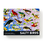 A 1000-piece jigsaw puzzle box titled 'SALTY BIRDS' featuring a colorful collage of various bird illustrations on a purple and blue background, with a black bottom banner containing the title.