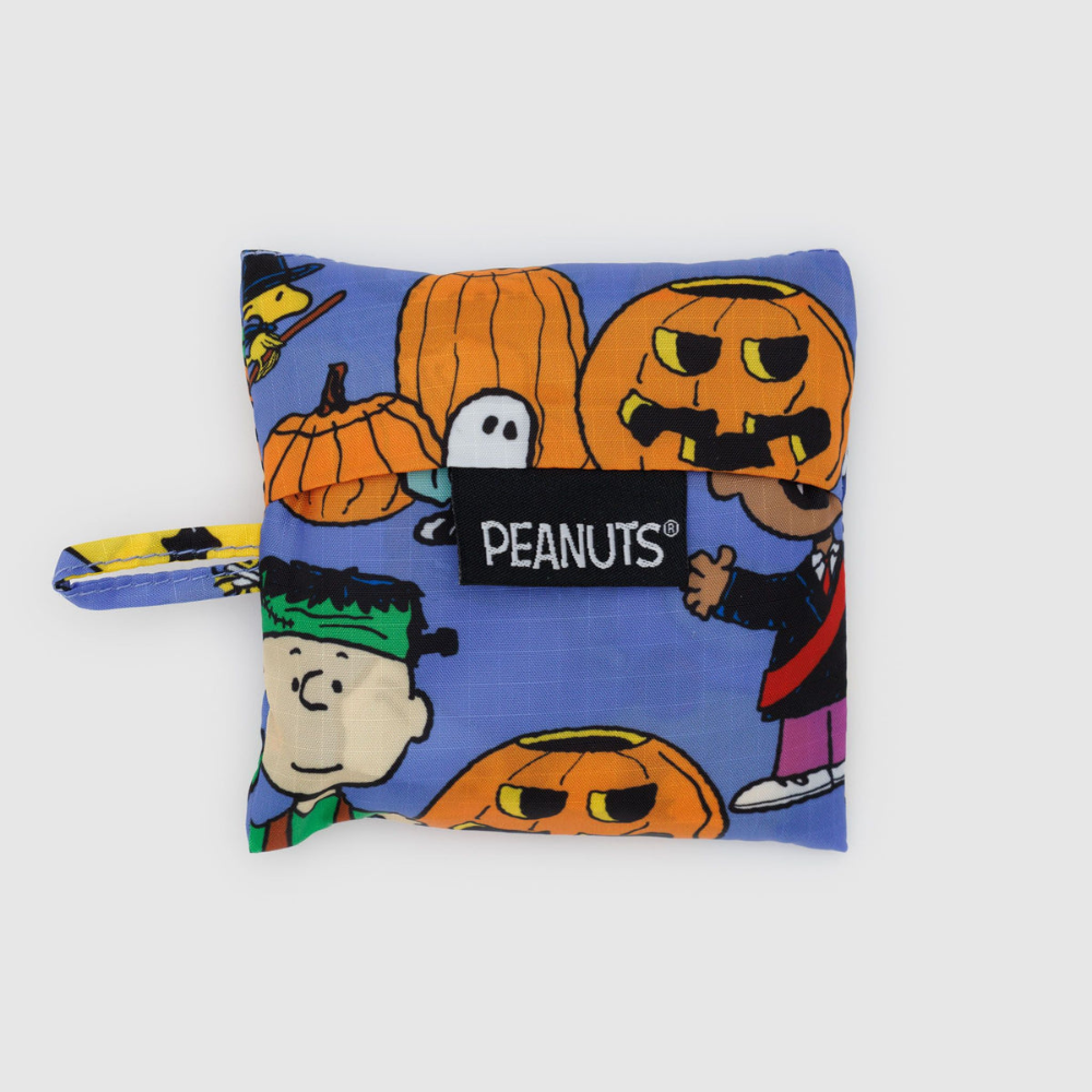 Peanuts-themed pouch with Halloween designs on a white background