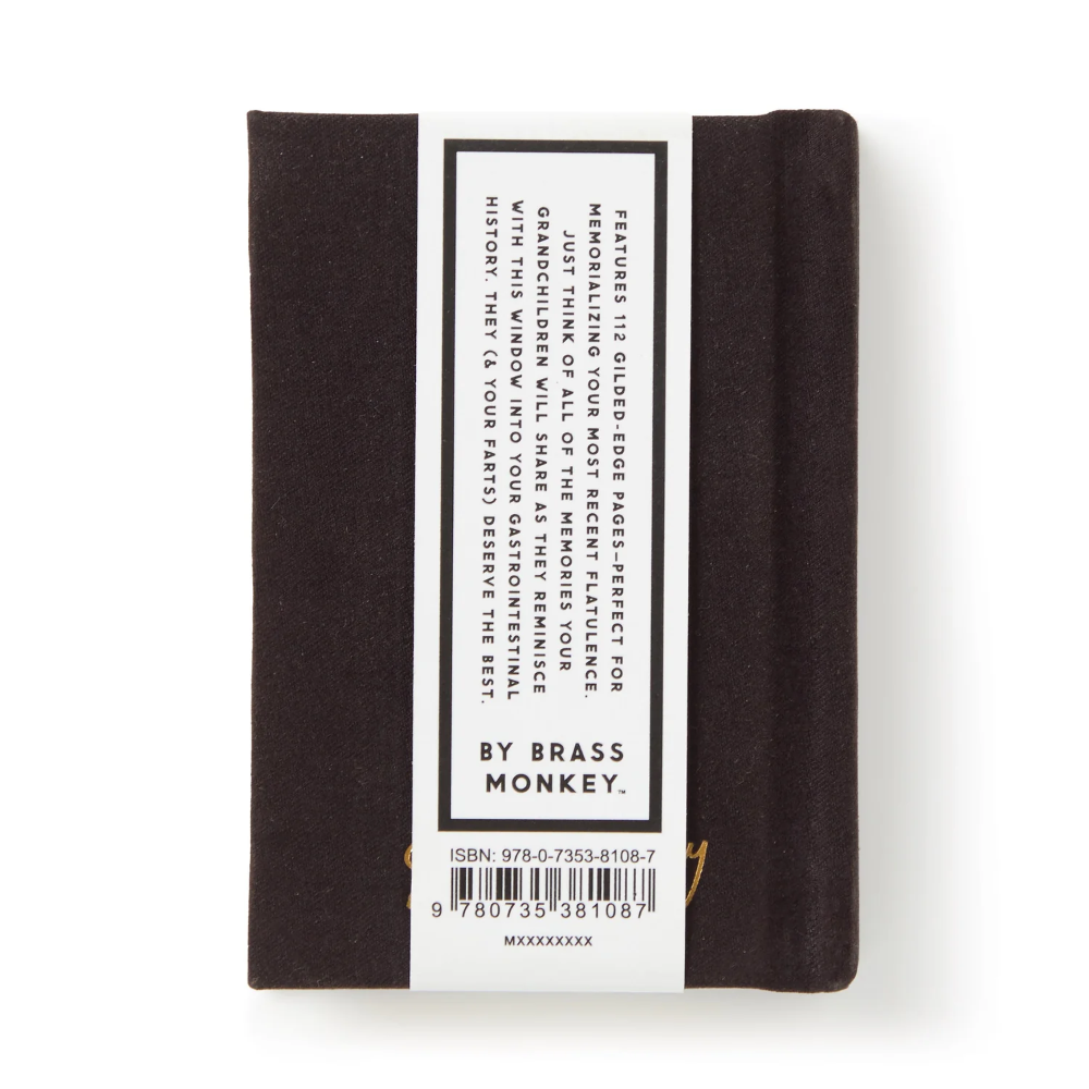 The back cover of a brass-bound notebook by Brass Monkey, featuring a white label with product details, ISBN, and barcode on a white background.