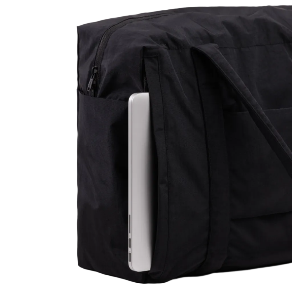 Black backpack with a laptop sleeve on a white background