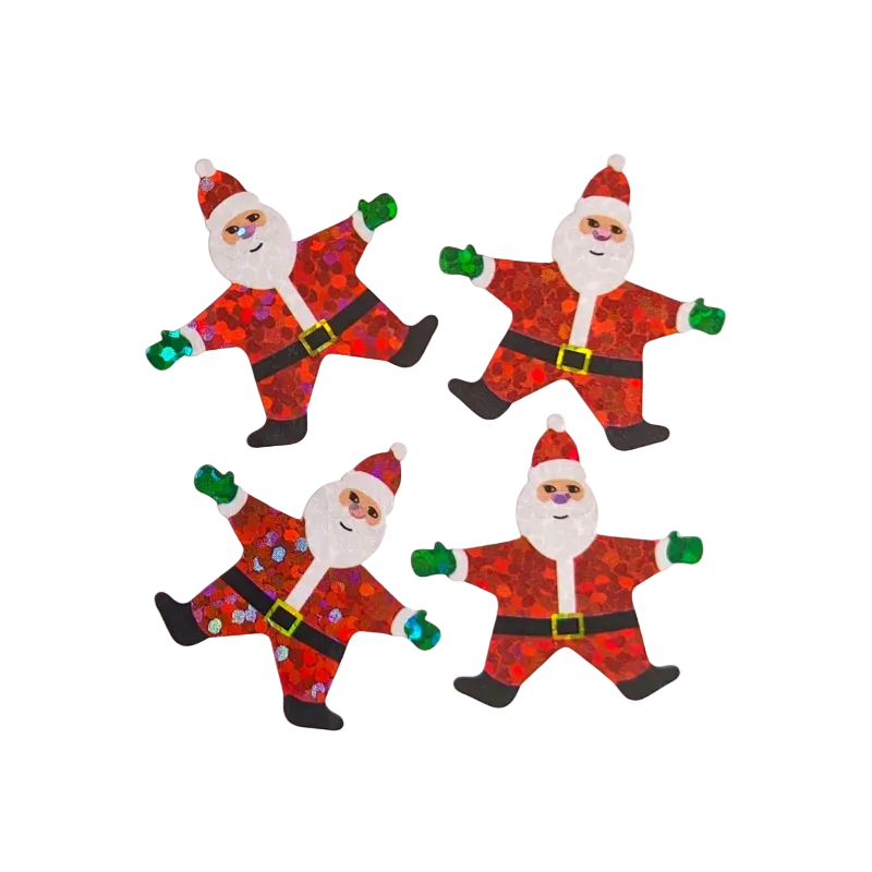 Four handmade glittery Santa Claus cutouts arranged in a 2x2 grid on a plain white background. The Santa figures are decorated with red and orange glitter patterns, white glitter beards and cuffs, green glitter mittens, and black glitter boots, with small gold glitter buckles.