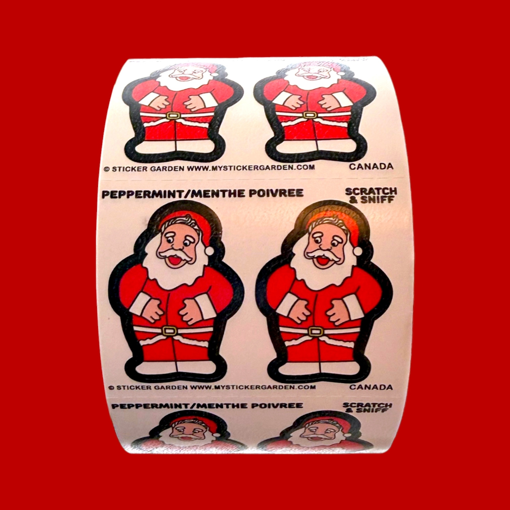 A roll of Christmas-themed stickers featuring cartoon Santa Claus illustrations with 'Peppermint/Menthe Poivree' and 'Scratch & Sniff' scent labels on a solid red background.