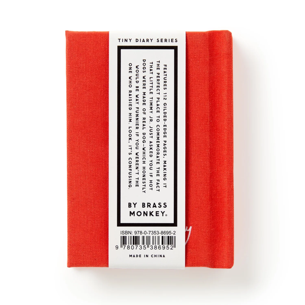 Red notebook with a label on a white background