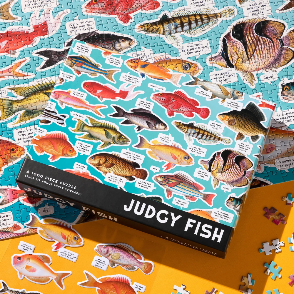 Jigsaw puzzle box with colorful fish illustrations and text on a blue background