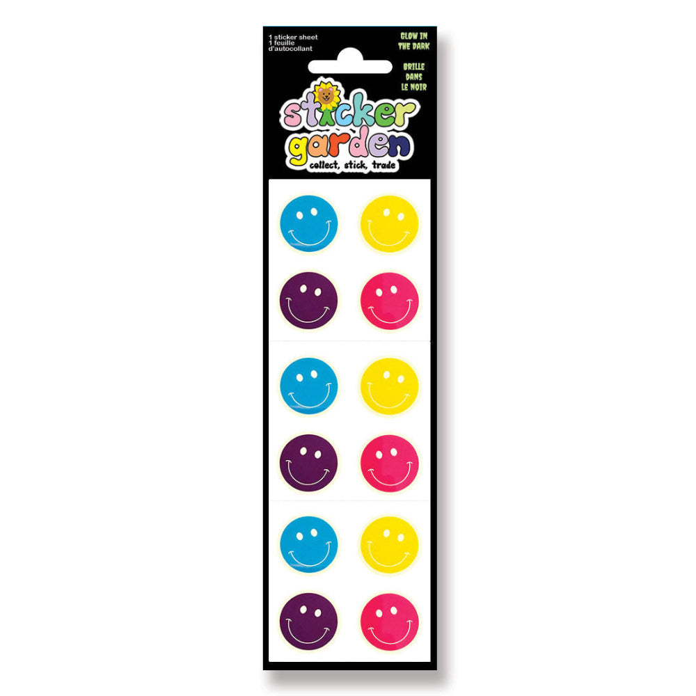 A package of 'Sticker Garden' glow-in-the-dark smiley face stickers. The product features a black header card with colorful branding and a white backing holding ten circular stickers in alternating bright colors: blue, yellow, purple, and pink.