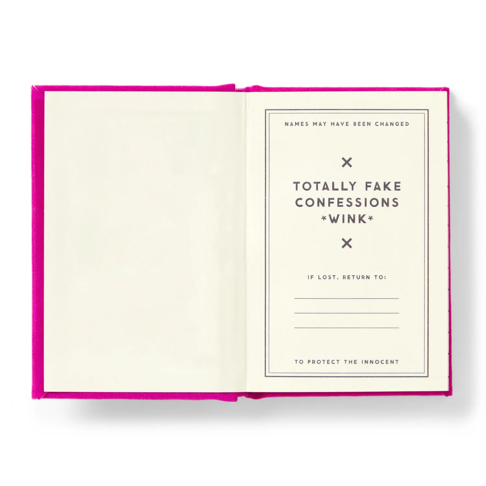 Open book with a pink cover and white pages displaying text.