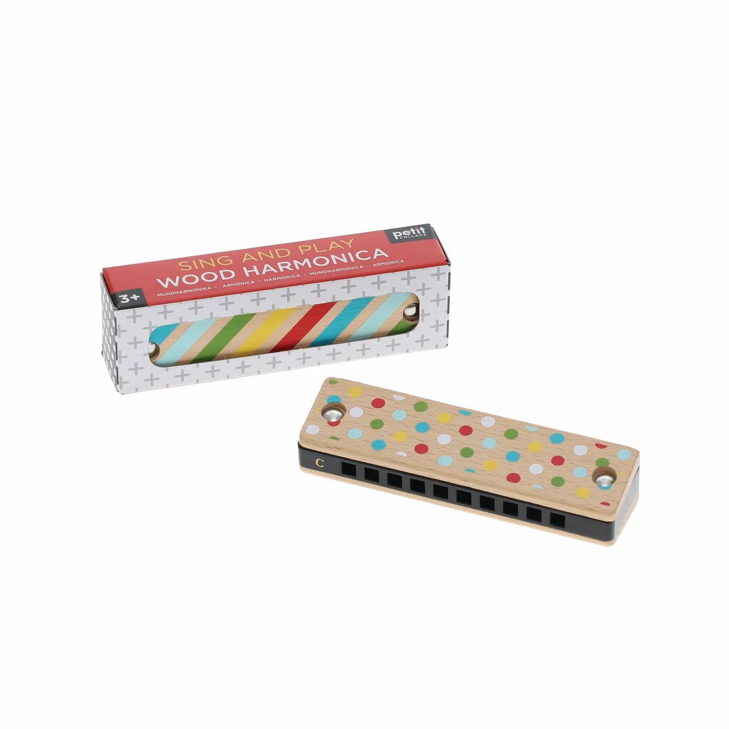 Wooden harmonica with colorful dot design next to its packaging on a white background