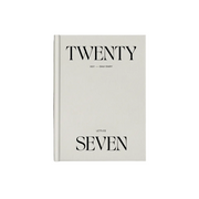 White diary with 'TWENTY SEVEN' text on a light gray background
