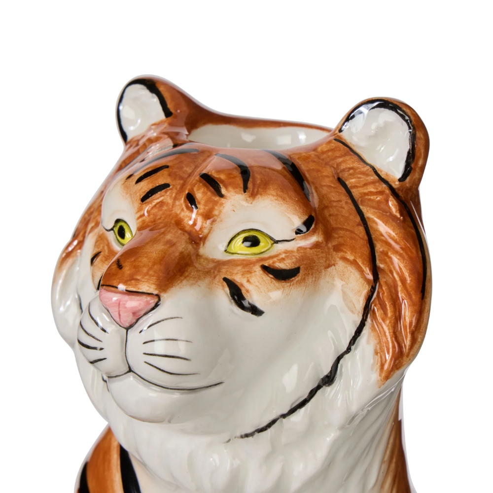 Ceramic tiger head with detailed face on a white background
