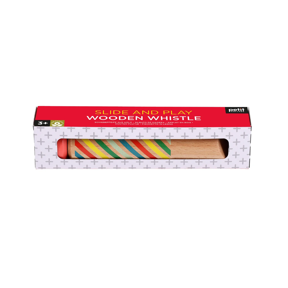 Wooden whistle in a box with colorful stripes on a white background