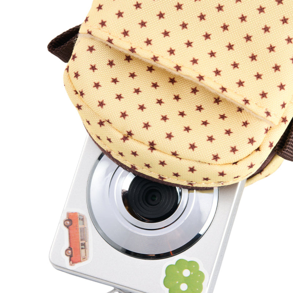 Small camera with a star-patterned cover on a white background