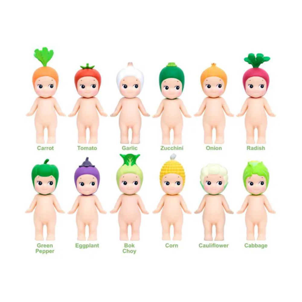 Set of vegetable-themed dolls with corresponding vegetables on a white background