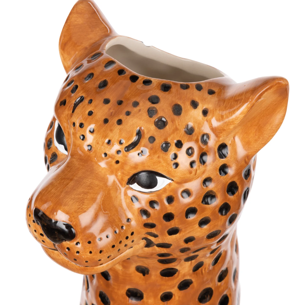 Ceramic vase shaped like a leopard head on a white background