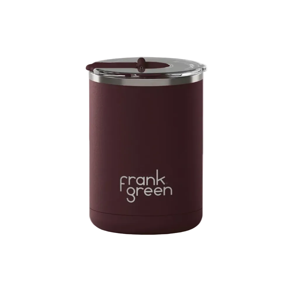 A dark burgundy insulated tumbler with a clear lid and a silver metal rim, featuring the 'frank green' logo printed in white on the front, set against a light gray background.