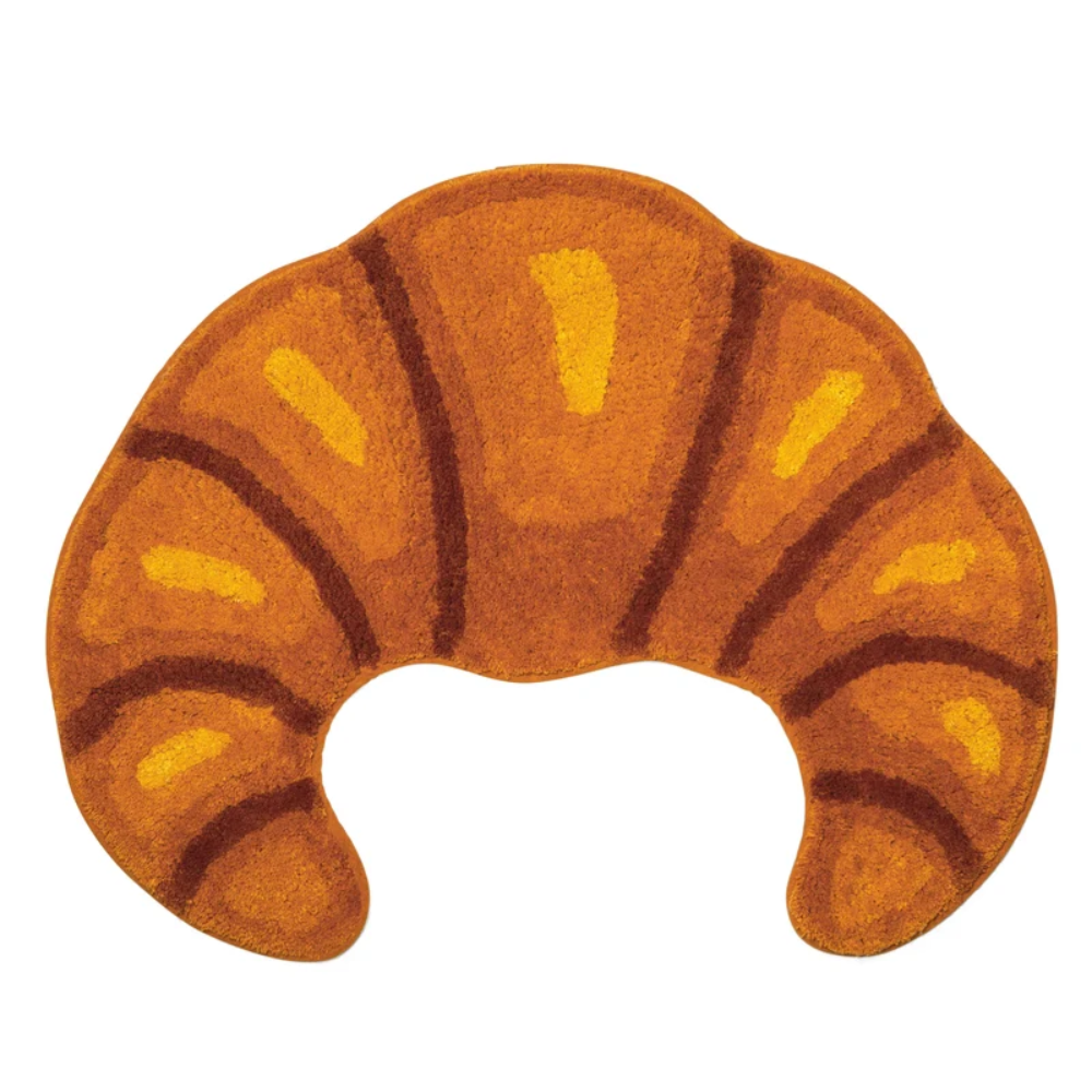 Decorative rug shaped like a croissant on a white background