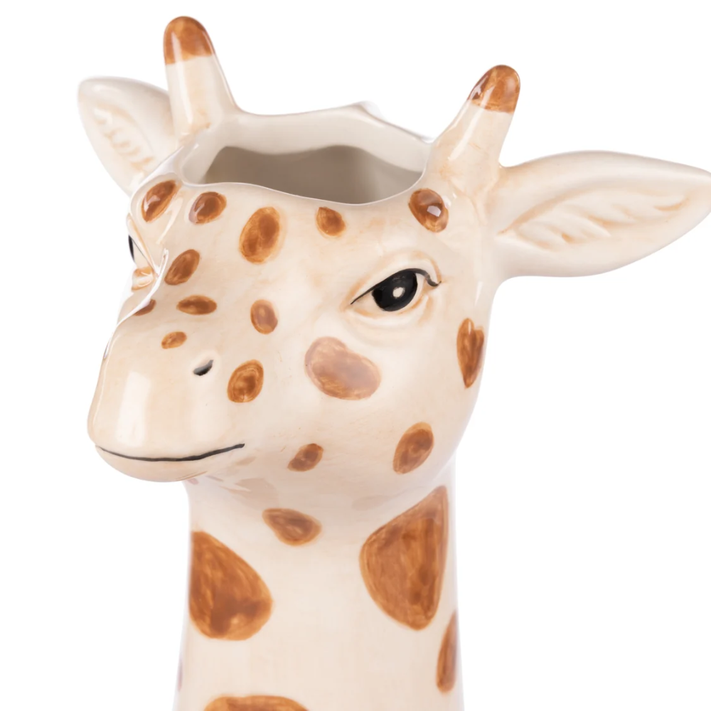 Giraffe-shaped ceramic planter on a white background