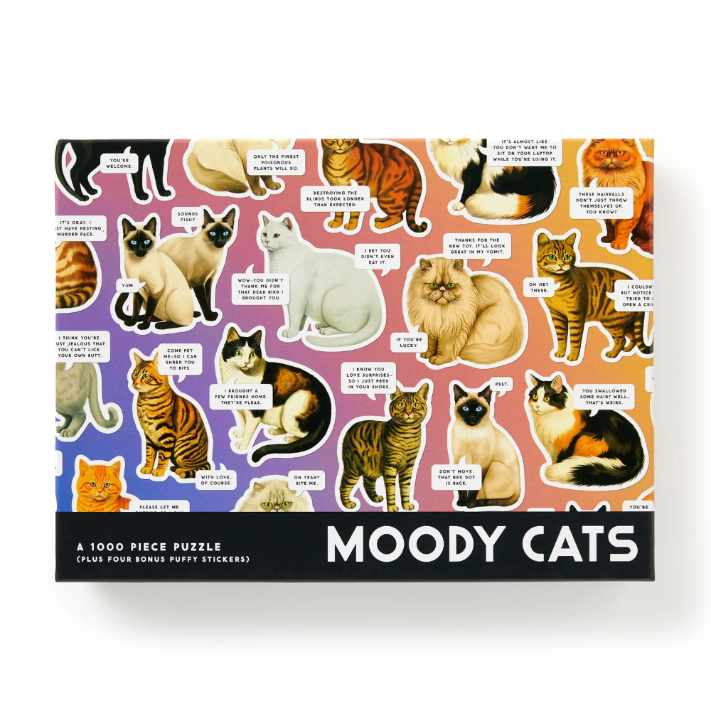 A 1000-piece jigsaw puzzle box titled 'MOODY CATS' featuring a colorful pattern of illustrated cats with humorous speech bubbles, set against a plain white background.